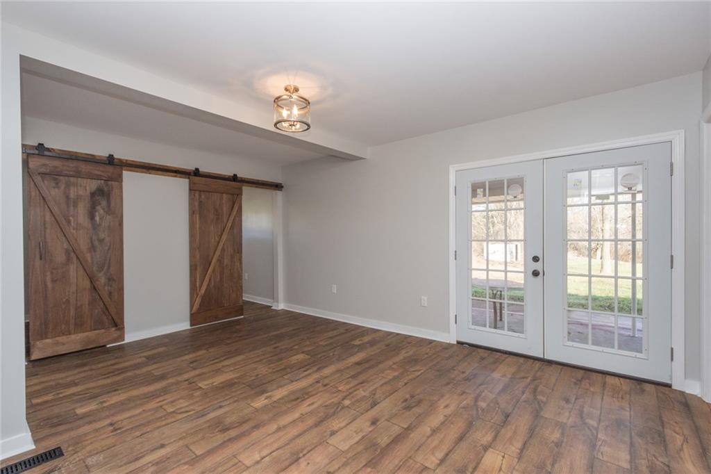 463 Center Grange Road Monaca, PA 15061 - Photo 13 of 21 Master bedroom, custom made barn doors for the two large closets. However, if you are looking for an office, this is sizeable and able to be used as an office.