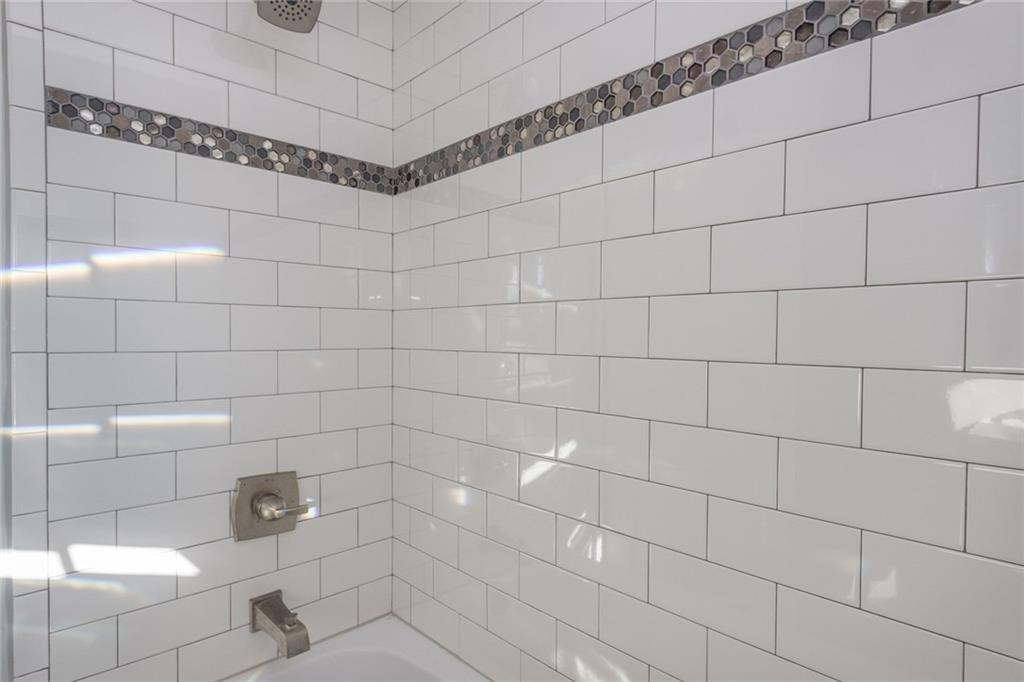 463 Center Grange Road Monaca, PA 15061 - Photo 19 of 21 A close up of the subway tile and a cool accent piece.