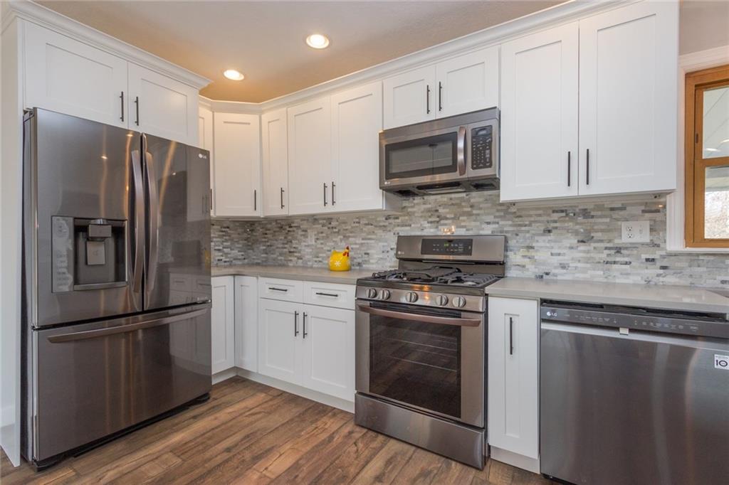 463 Center Grange Road Monaca, PA 15061 - Photo 6 of 21 Black stainless steel LG appliances, quartz countertops and soft close doors and drawers.