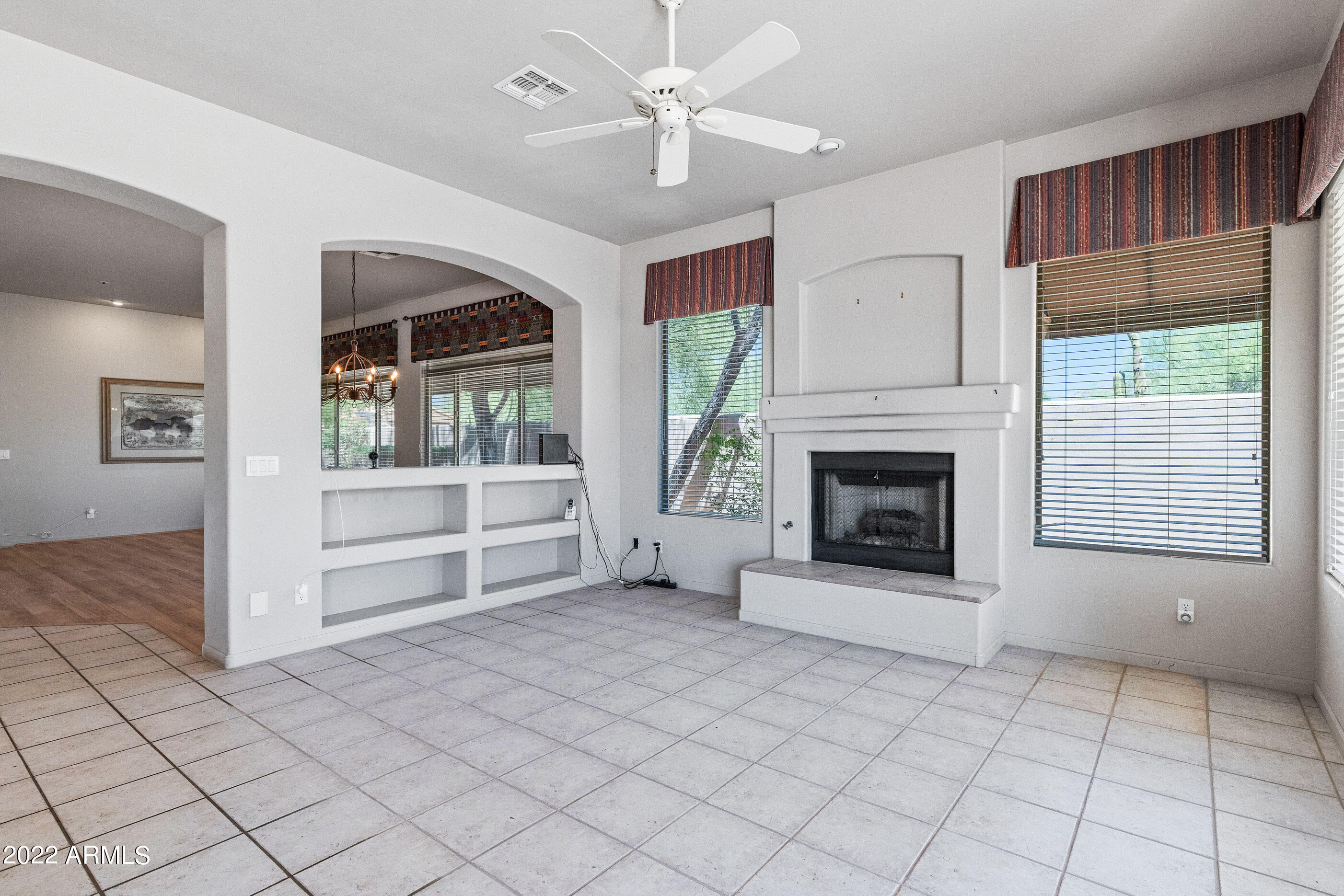 8247 East Mountain Spring Road Scottsdale, AZ 85255 - Photo 12 of 42 family room w/ fireplace