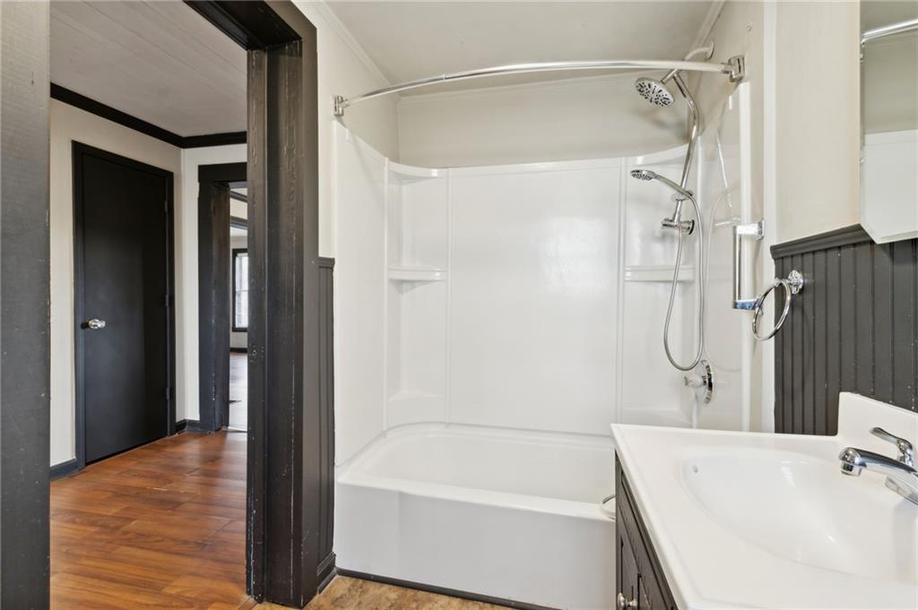 669 Leather Street Buford, GA 30518 - Photo 29 of 46 a bathroom with a bathtub and a shower