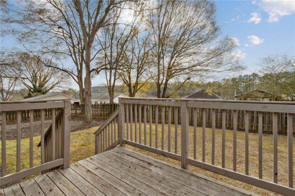 669 Leather Street Buford, GA 30518 - Photo 30 of 46 a view of a wooden deck with a yard