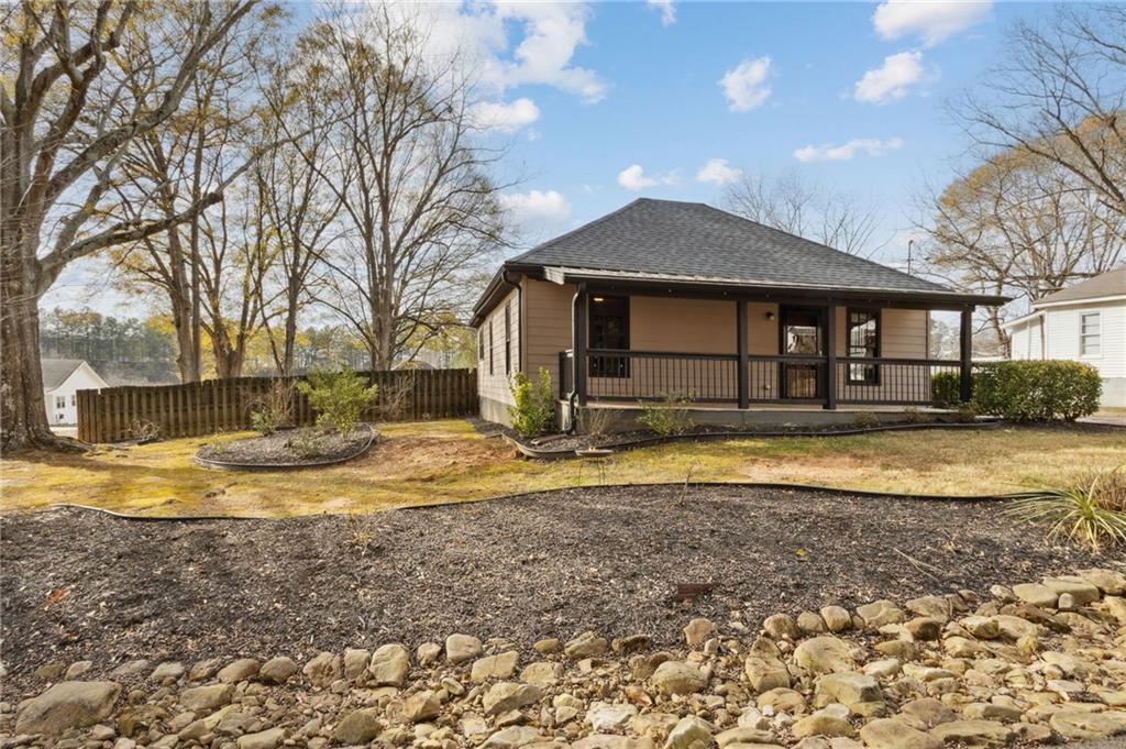 669 Leather Street Buford, GA 30518 - Photo 3 of 46 a view of a house with a yard