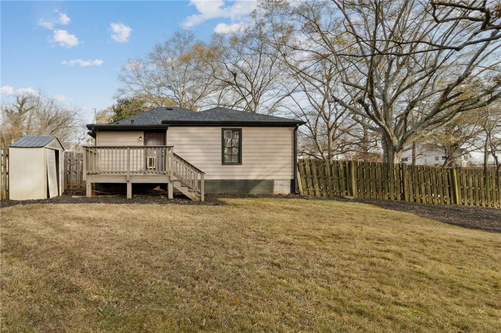 669 Leather Street Buford, GA 30518 - Photo 32 of 46 a house with trees in front of it