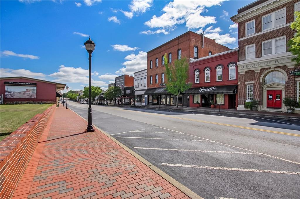 669 Leather Street Buford, GA 30518 - Photo 41 of 46 a view of a street with a building in the background