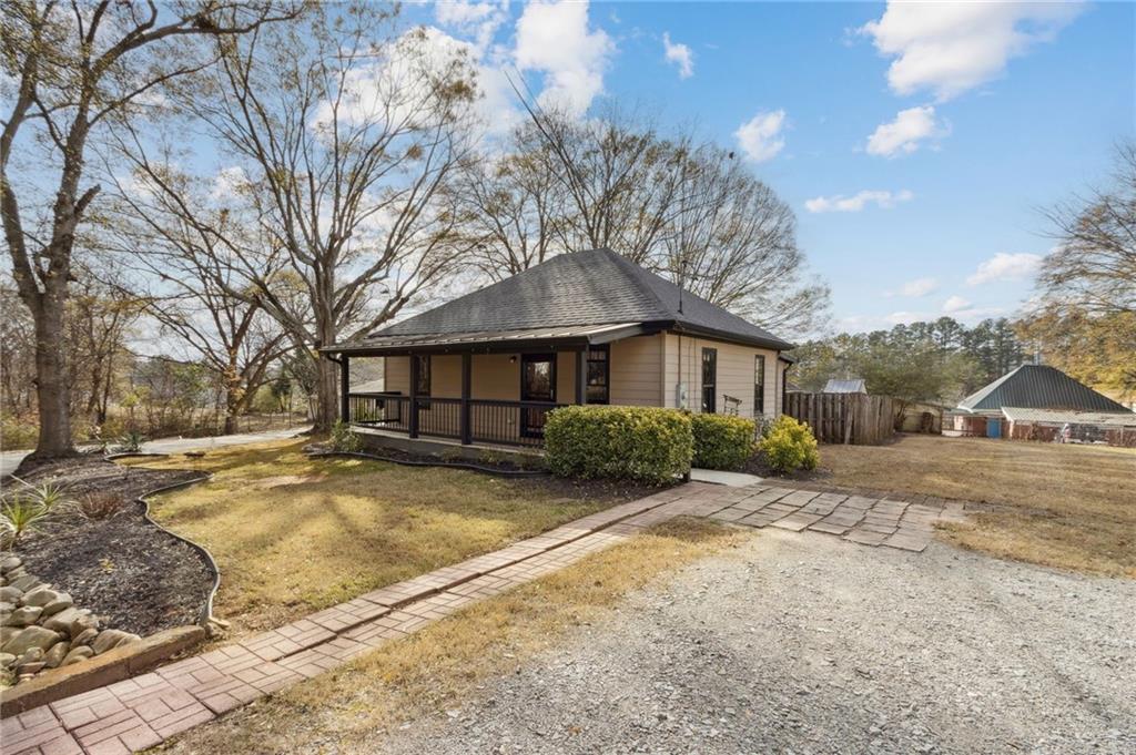 669 Leather Street Buford, GA 30518 - Photo 5 of 46 a view of a yard with a large tree