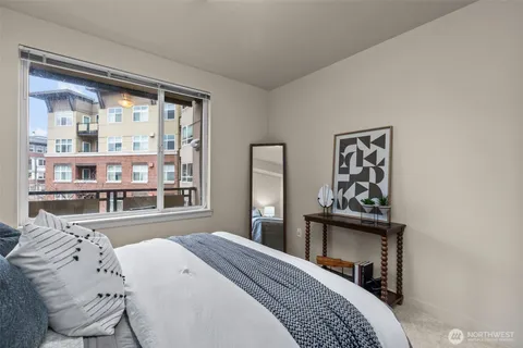 a bedroom with a bed and a dresser