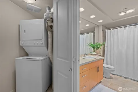 a bathroom with a toilet a sink and a mirror