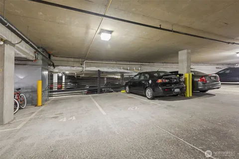 a view of parking garage with cars