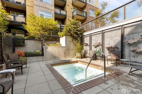 a view of a patio with a table and chairs