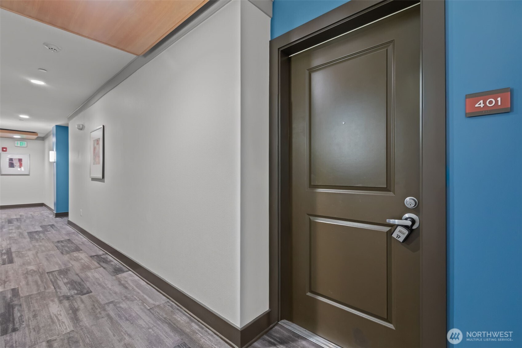 5440 Leary Avenue Northwest, Unit 401 Seattle, WA 98107 - Photo 3 of 40 a view of a hallway with wooden floor