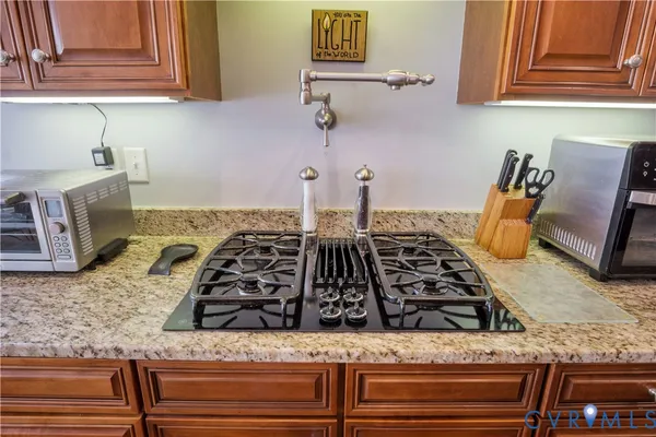 a living room with furniture a fireplace and a floor to ceiling window