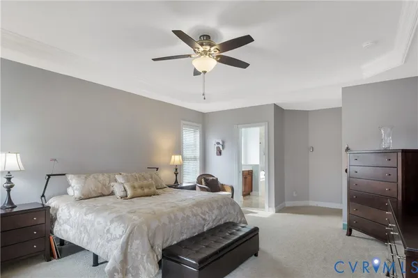 a bathroom with a bathtub a shower a sink and a large window