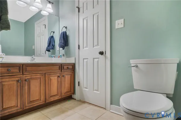 a spacious bathroom with a sink and a mirror