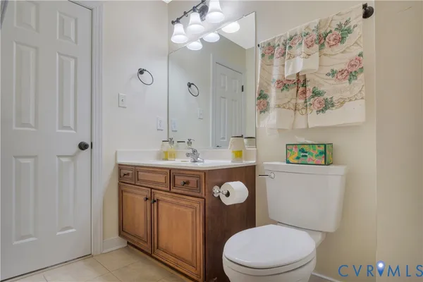 a living room with furniture and stairs