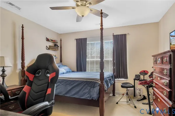 a view of a livingroom with furniture and lounge chair