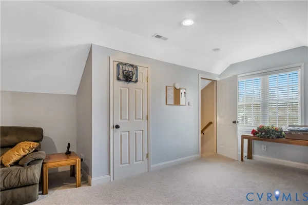a kitchen with stainless steel appliances a refrigerator and wooden floor