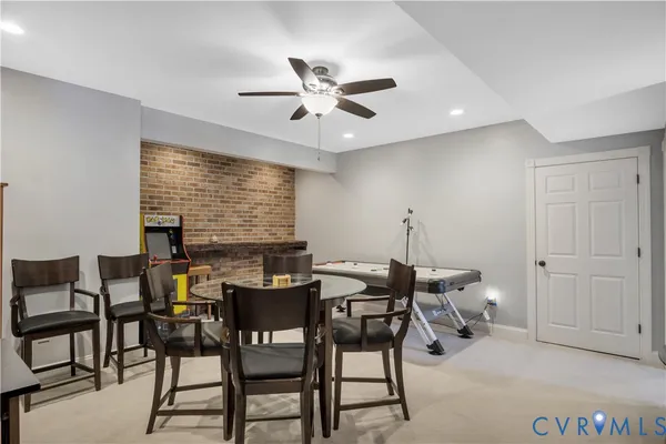 a bedroom with bed large window and potted plant