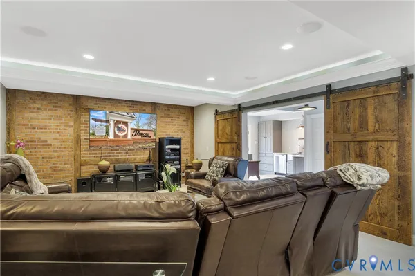 a bathroom with a toilet sink vanity granite and shower