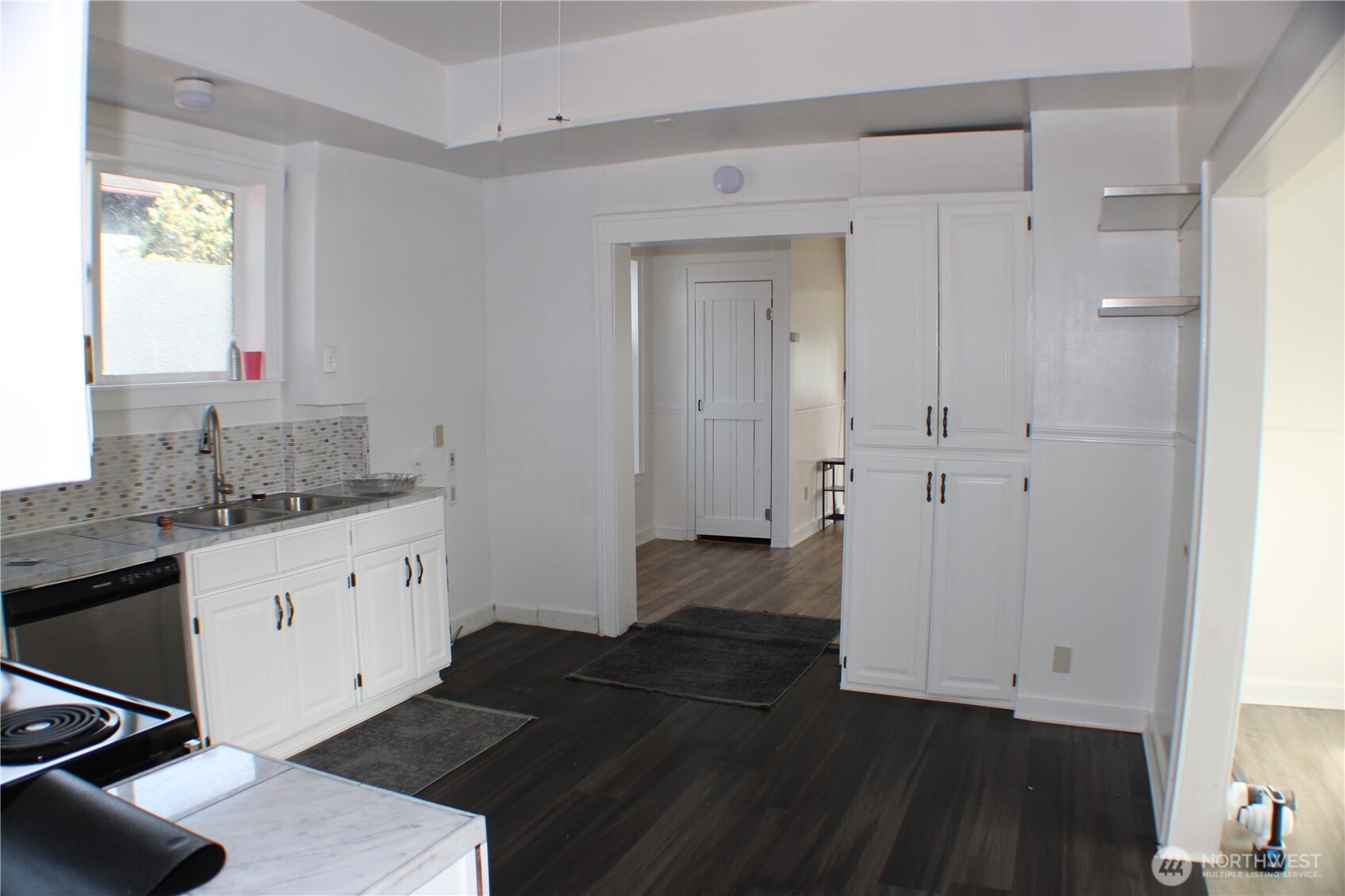 1224 4th Street Cosmopolis, WA 98537 - Photo 14 of 33 a bathroom with a sink and a mirror
