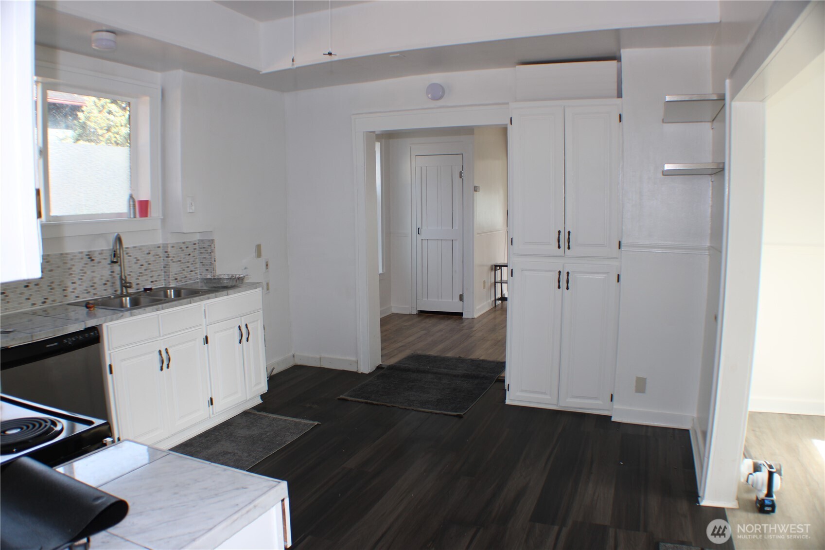 1224 4th Street Cosmopolis, WA 98537 - Photo 15 of 33 a kitchen with a sink and cabinets