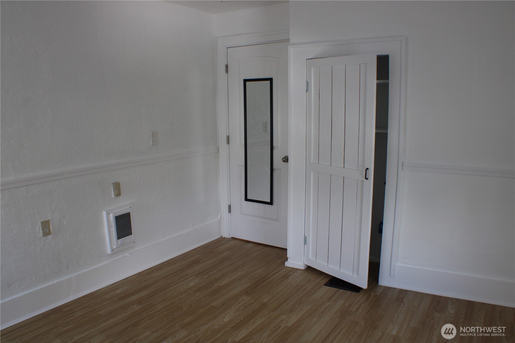 1224 4th Street Cosmopolis, WA 98537 - Photo 28 of 33 an empty room with wooden floor and closet