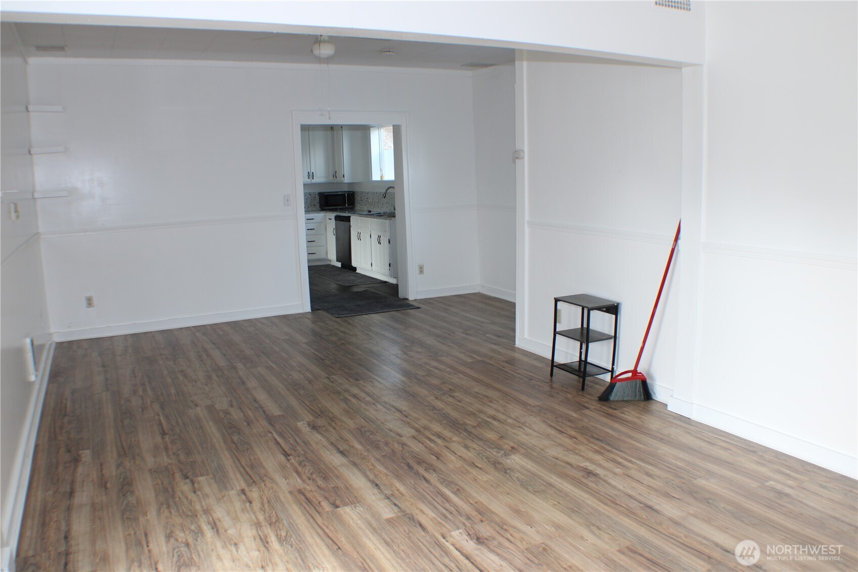 1224 4th Street Cosmopolis, WA 98537 - Photo 3 of 33 an empty room with wooden floor and a window