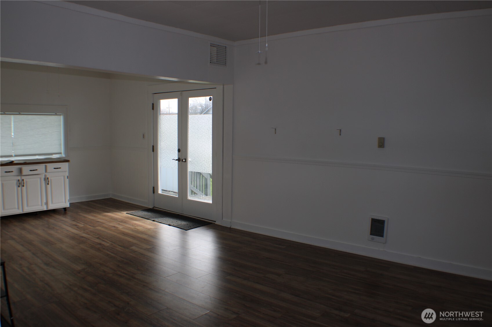 1224 4th Street Cosmopolis, WA 98537 - Photo 5 of 33 a view of an empty room with window and wooden floor