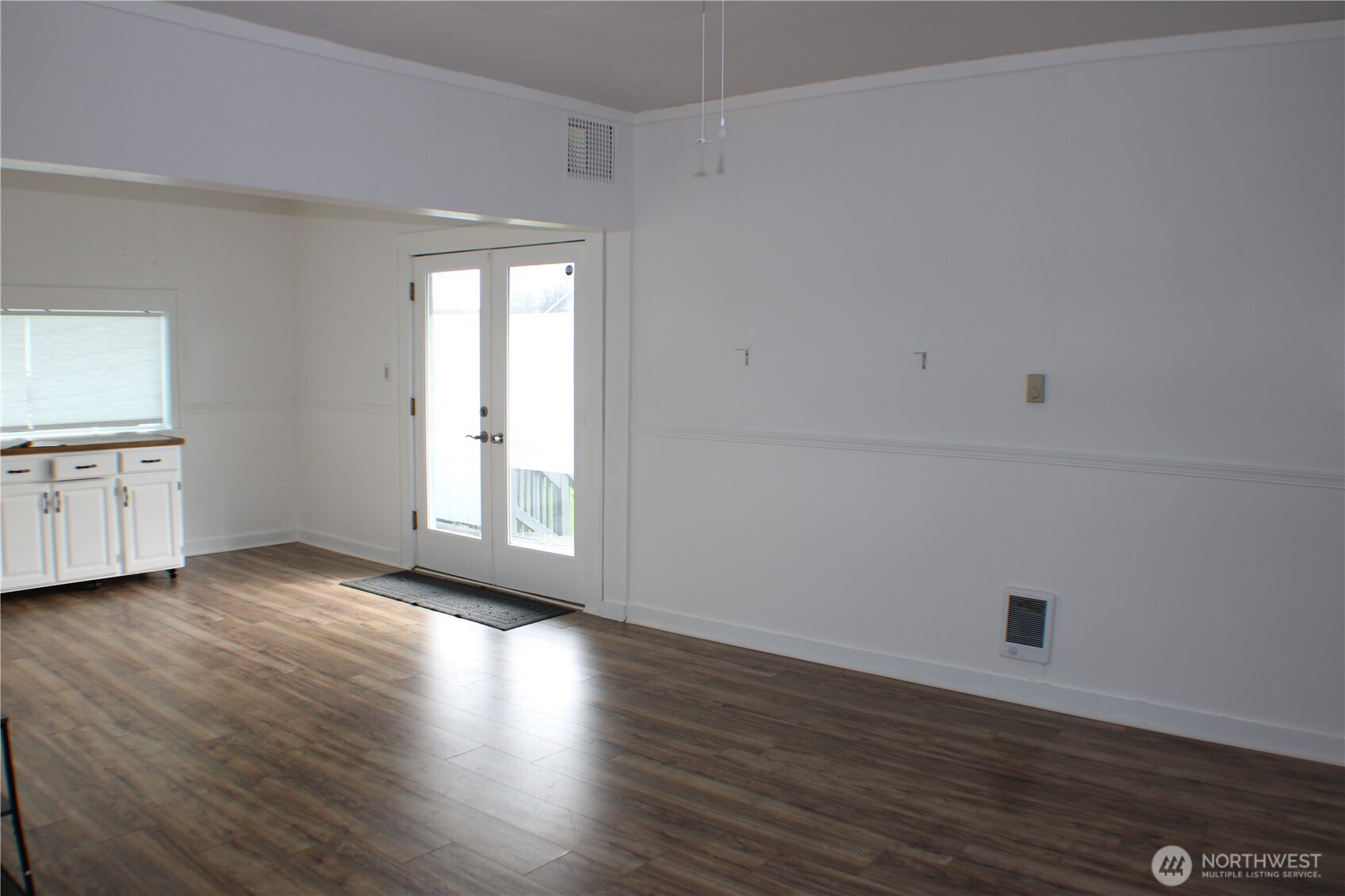 1224 4th Street Cosmopolis, WA 98537 - Photo 6 of 33 a view of an empty room with window and wooden floor
