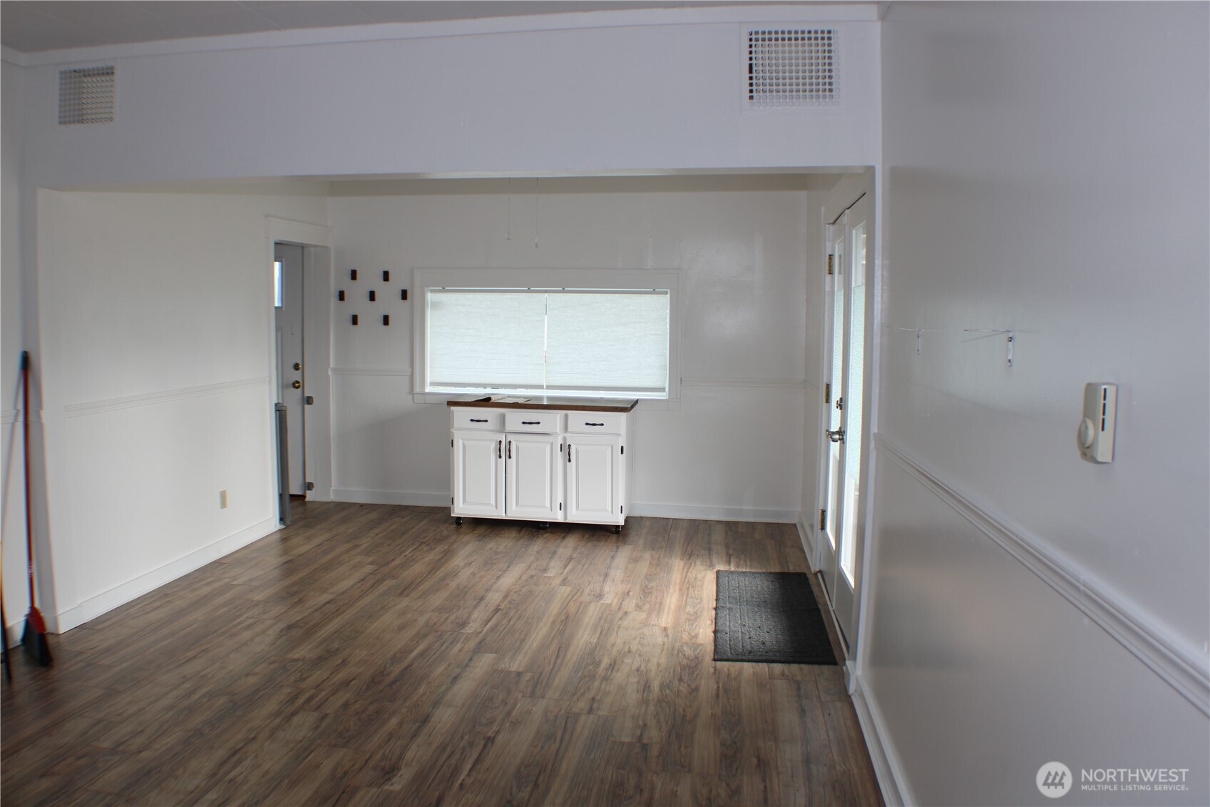 1224 4th Street Cosmopolis, WA 98537 - Photo 7 of 33 a view of a kitchen with wooden floor and electronic appliances