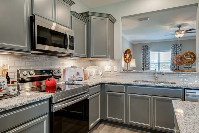 a view of a dining room with furniture and window