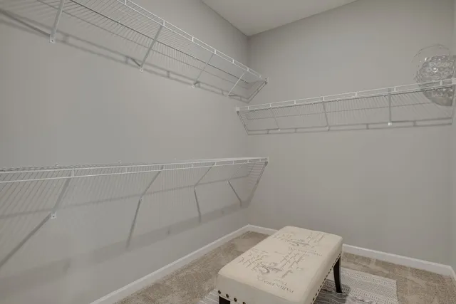 a bath tub sitting in a bathroom next to a sink