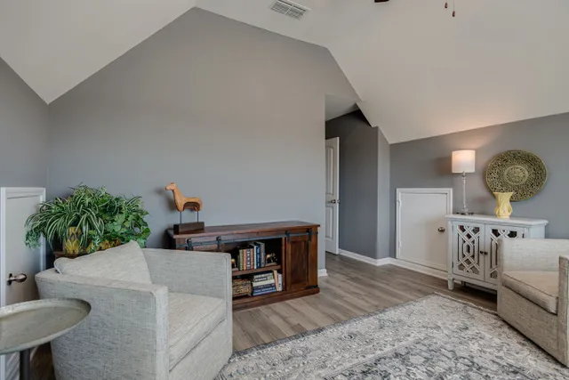 a kitchen with stainless steel appliances granite countertop a stove a sink a microwave a refrigerator and cabinets