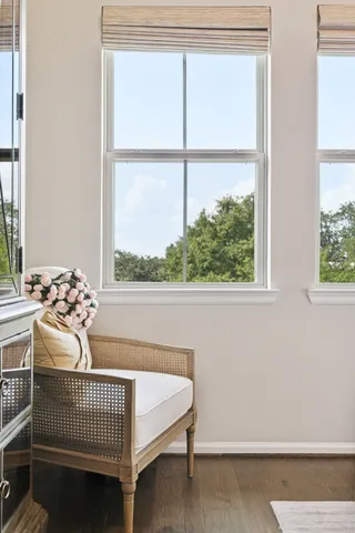 a bedroom with a bed and windows