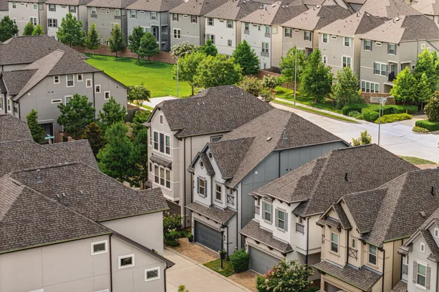 a aerial view of a house with a yard