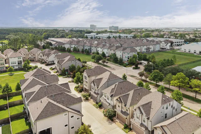an aerial view of residential house with outdoor space and river