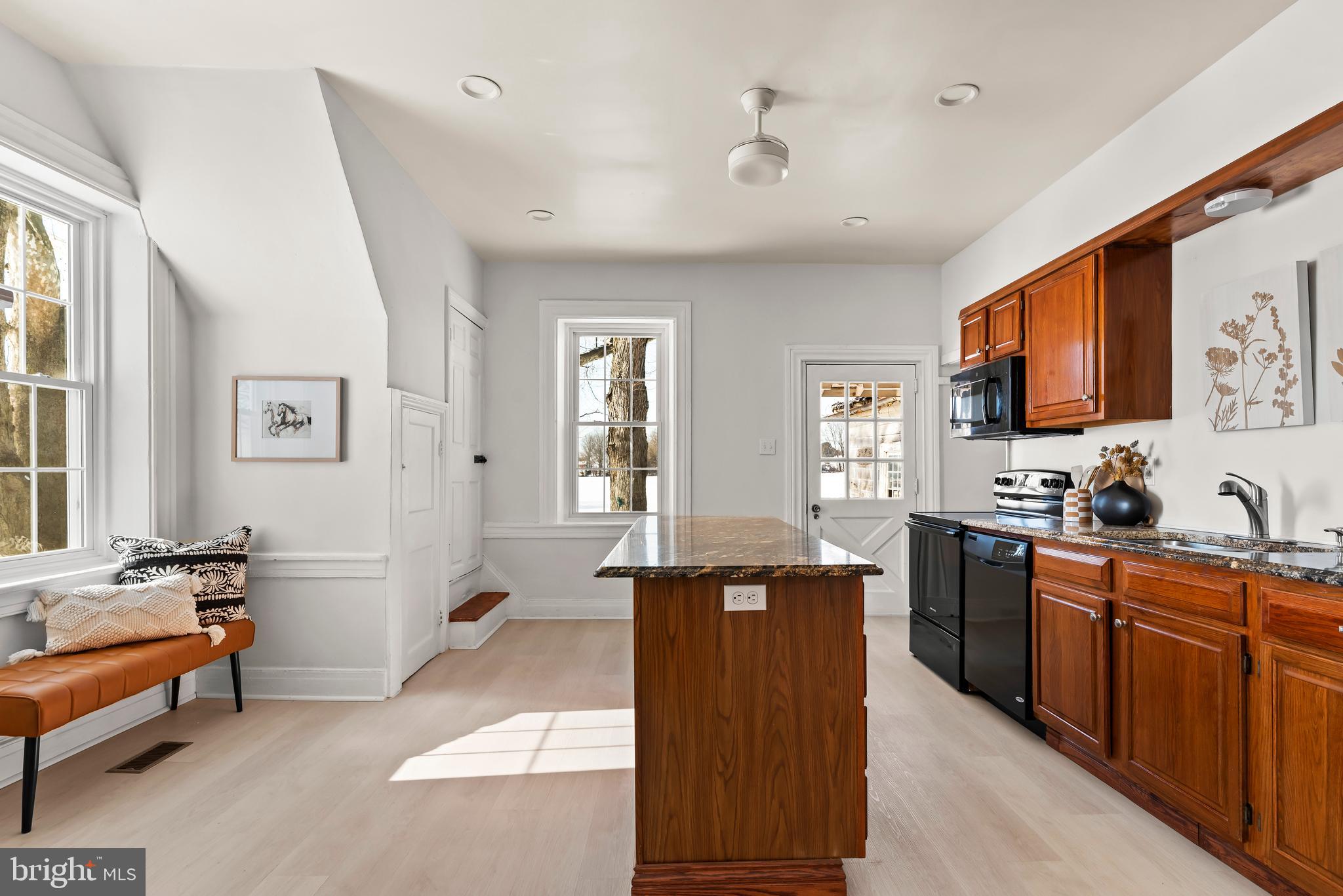 320 South Middlesex Road Carlisle, PA 17015 - Photo 11 of 66 a large kitchen with stainless steel appliances kitchen island granite countertop a refrigerator and a stove top oven