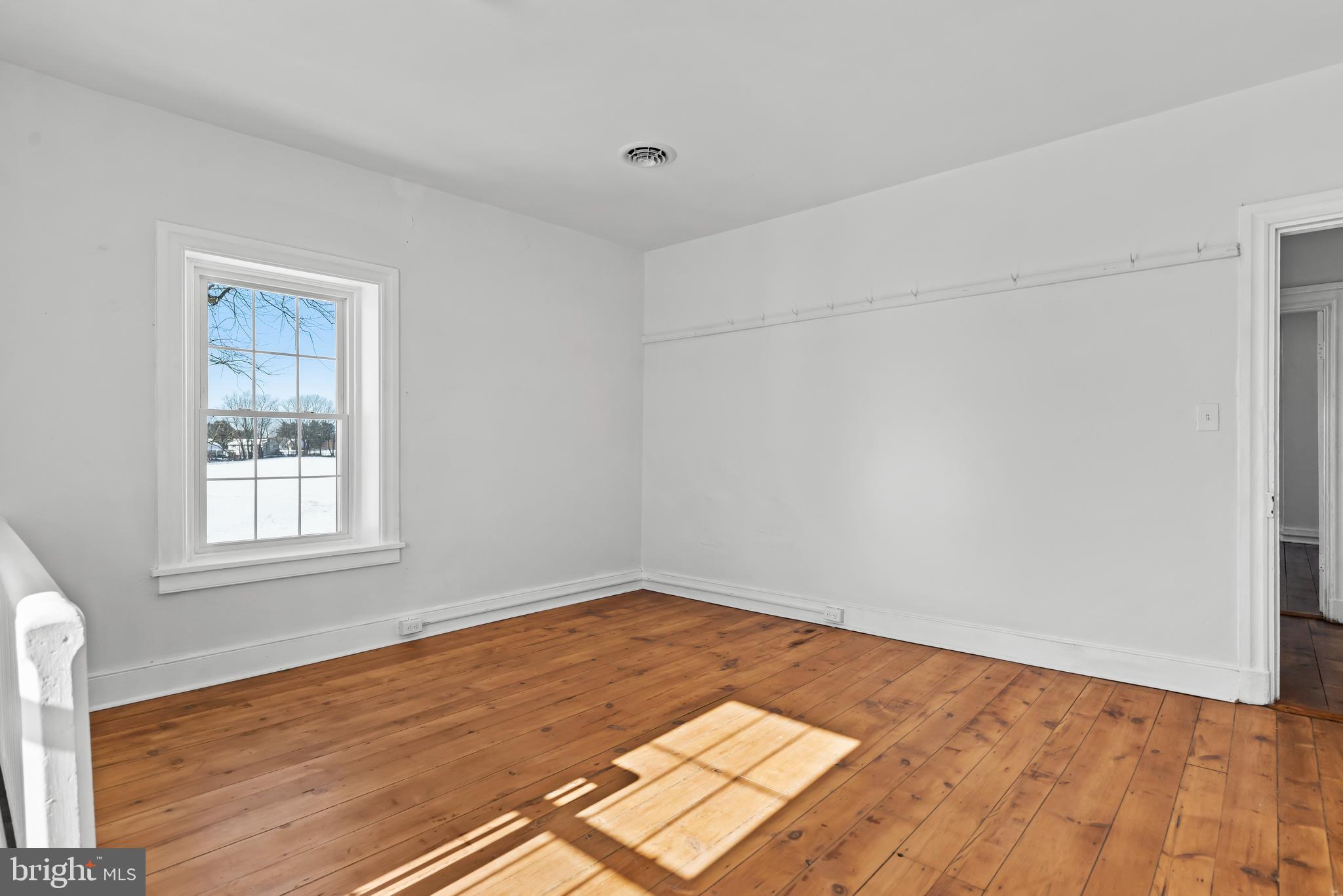 320 South Middlesex Road Carlisle, PA 17015 - Photo 33 of 66 an empty room with wooden floor and windows