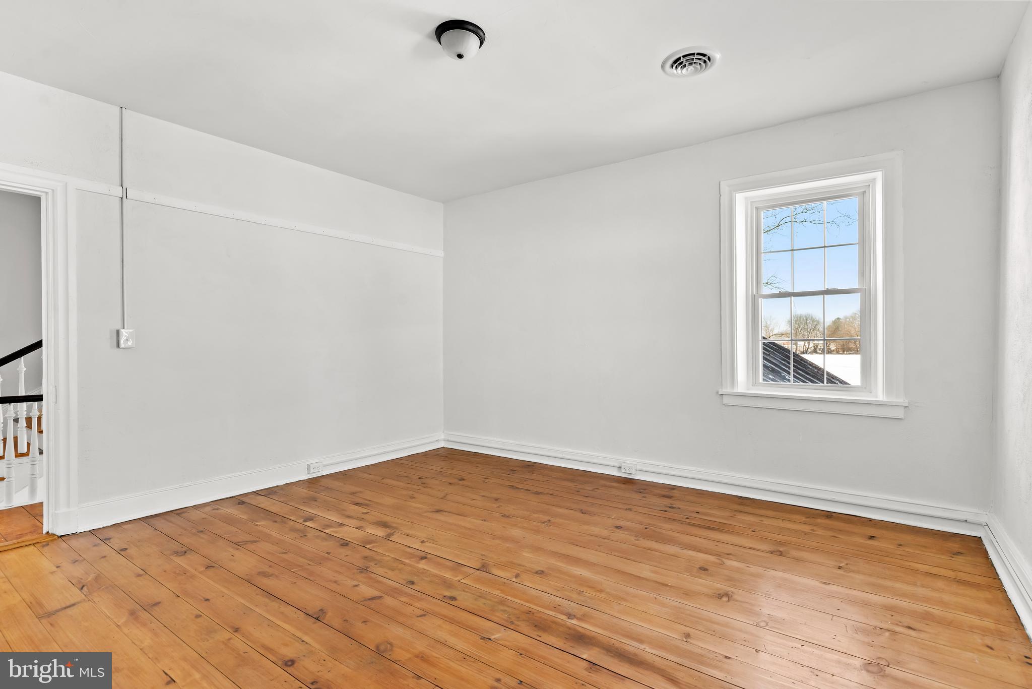 320 South Middlesex Road Carlisle, PA 17015 - Photo 34 of 66 an empty room with wooden floor and windows