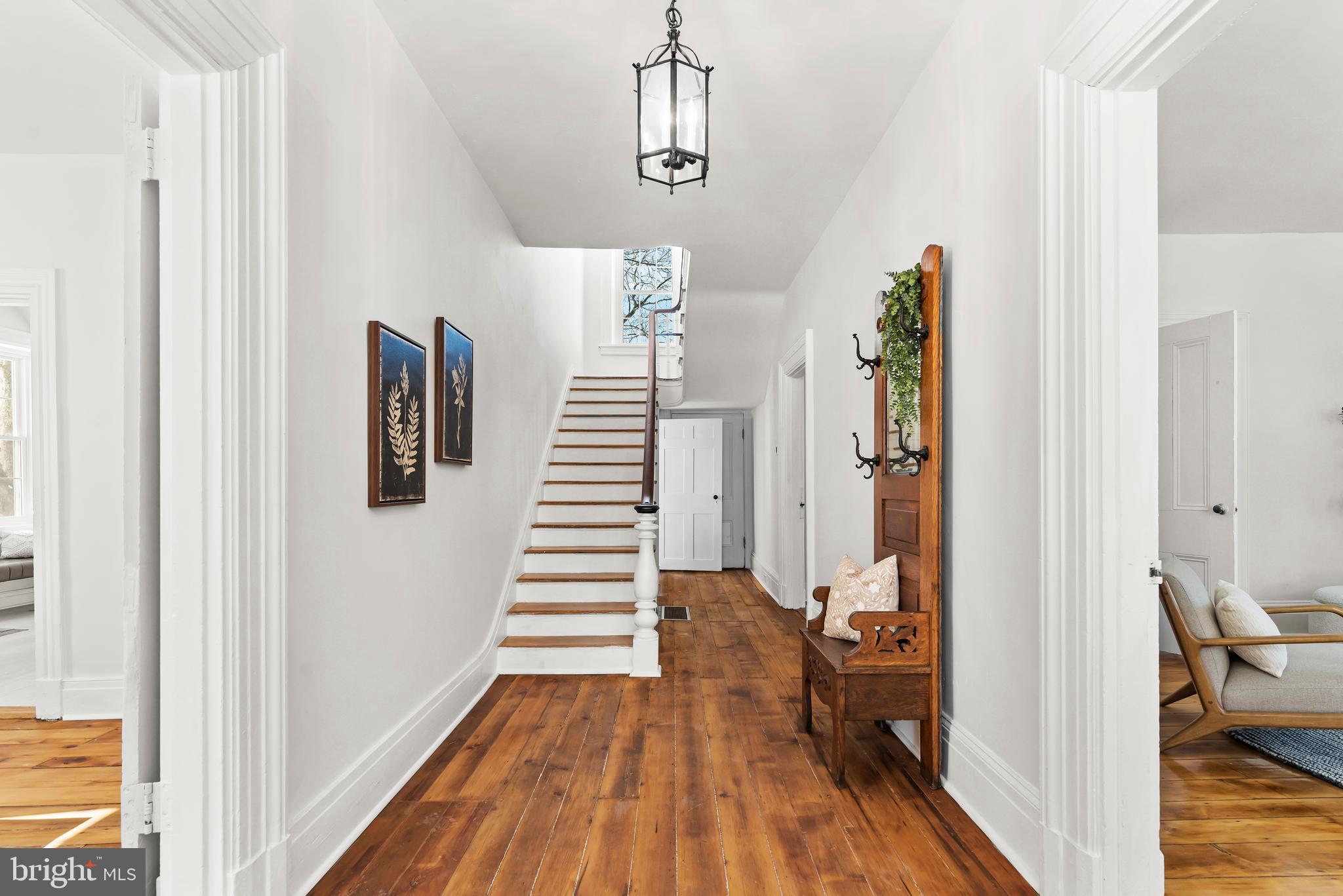 320 South Middlesex Road Carlisle, PA 17015 - Photo 6 of 66 a view of a hallway with wooden floor and staircase