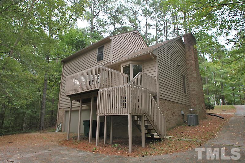 27 Sandstone Ridge Drive Durham, NC 27713 - Photo 12 of 12 a front view of a house with a garden