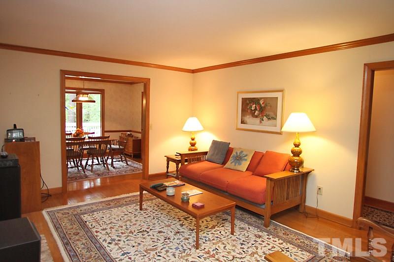 27 Sandstone Ridge Drive Durham, NC 27713 - Photo 3 of 12 a living room with furniture and a rug