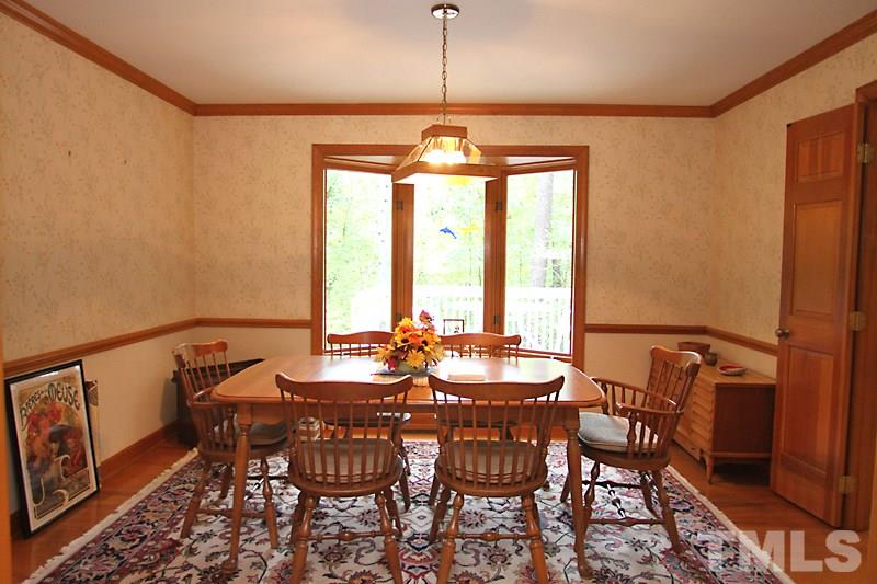 27 Sandstone Ridge Drive Durham, NC 27713 - Photo 4 of 12 a view of a dining room with furniture and window