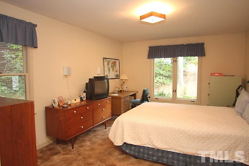 27 Sandstone Ridge Drive Durham, NC 27713 - Photo 7 of 12 a bedroom with a bed and window