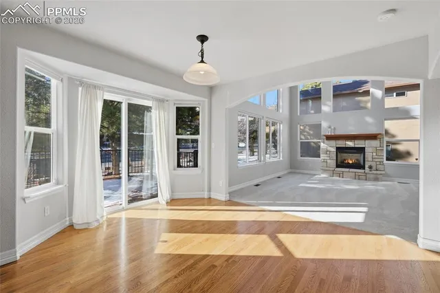 a living room with fireplace furniture and a fireplace