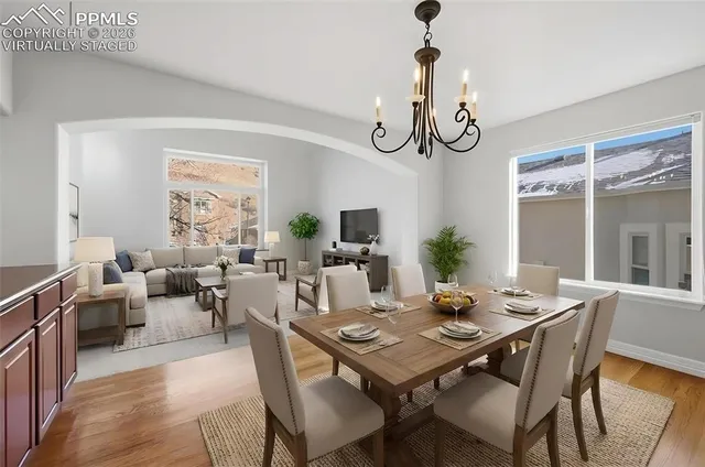 a view of a dining room with furniture window and wooden floor