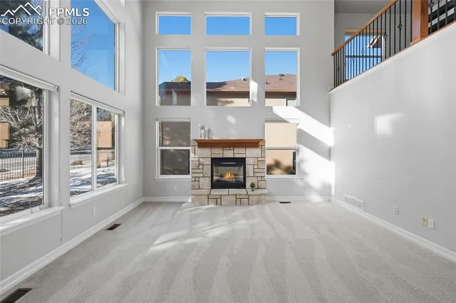 a view of a livingroom with furniture and a fireplace