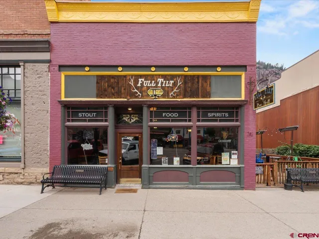 a cafe on the corner of the building