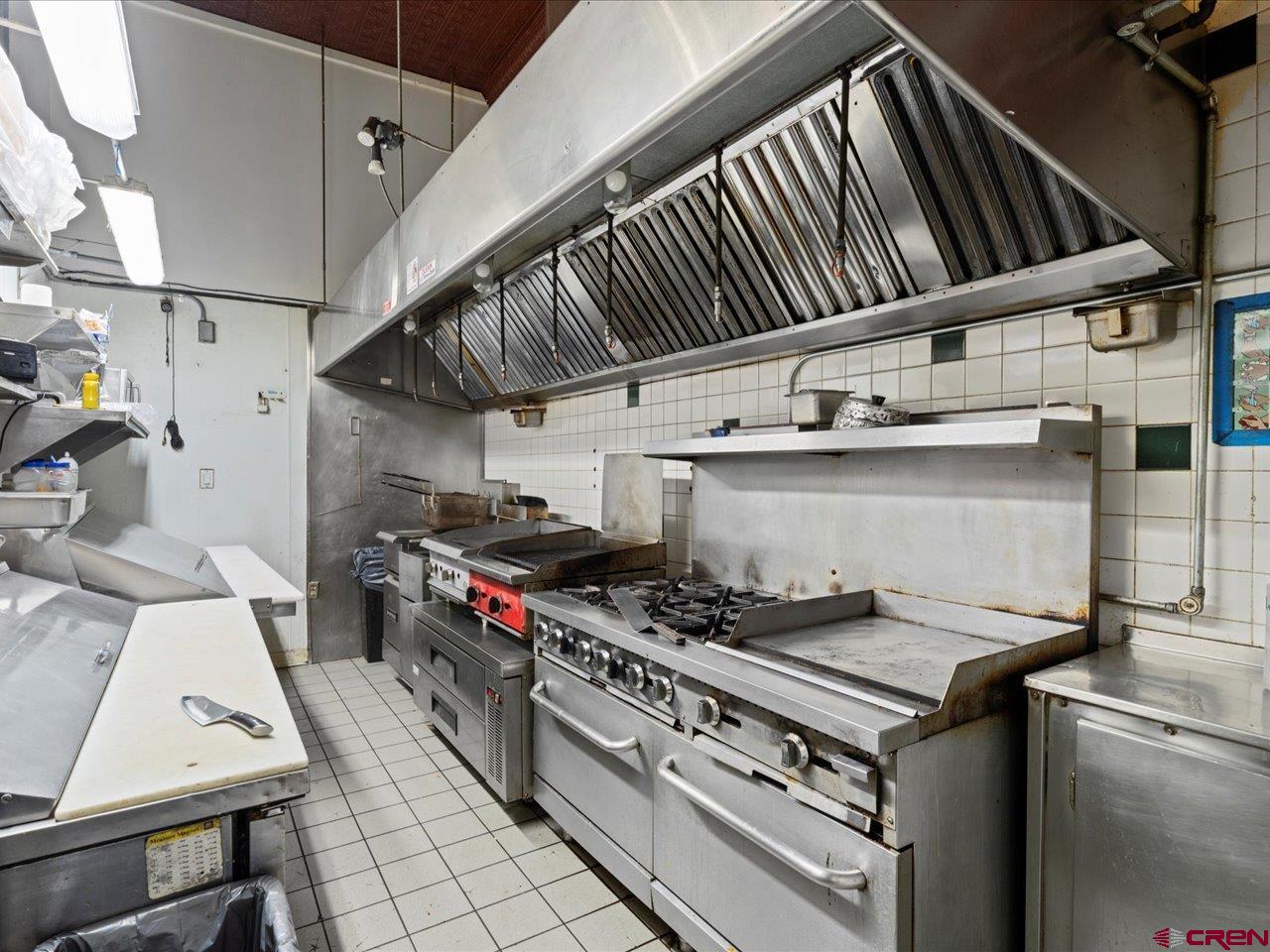 726 Main Street Ouray, CO 81427 - Photo 11 of 41 a stove top oven sitting inside of a kitchen