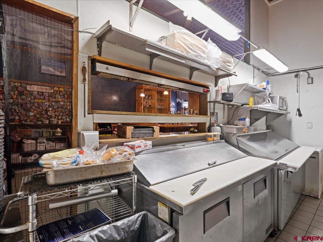 726 Main Street Ouray, CO 81427 - Photo 12 of 41 a utility room with stainless steel appliances and stove